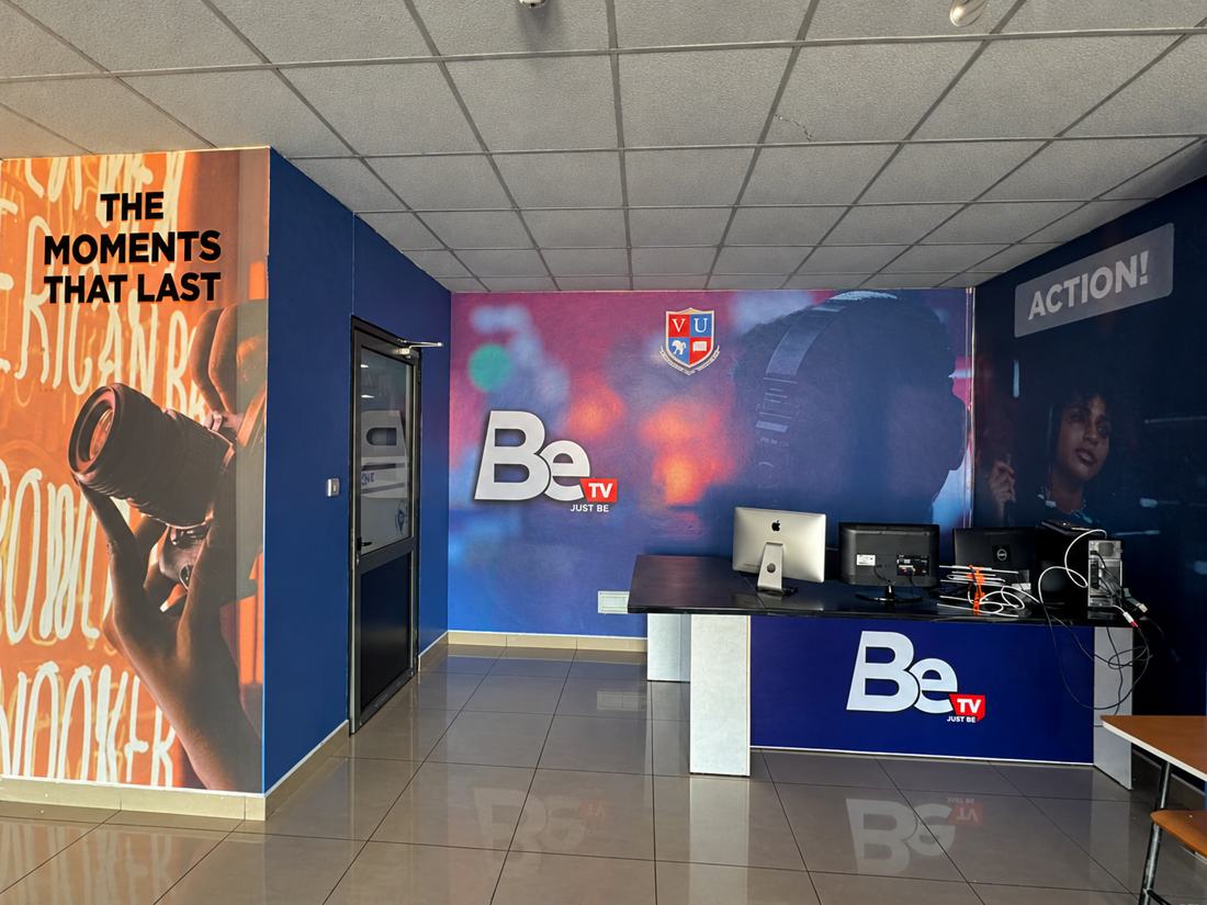 Be TV reception wall wrap and large format interior branding by Crane Engravers